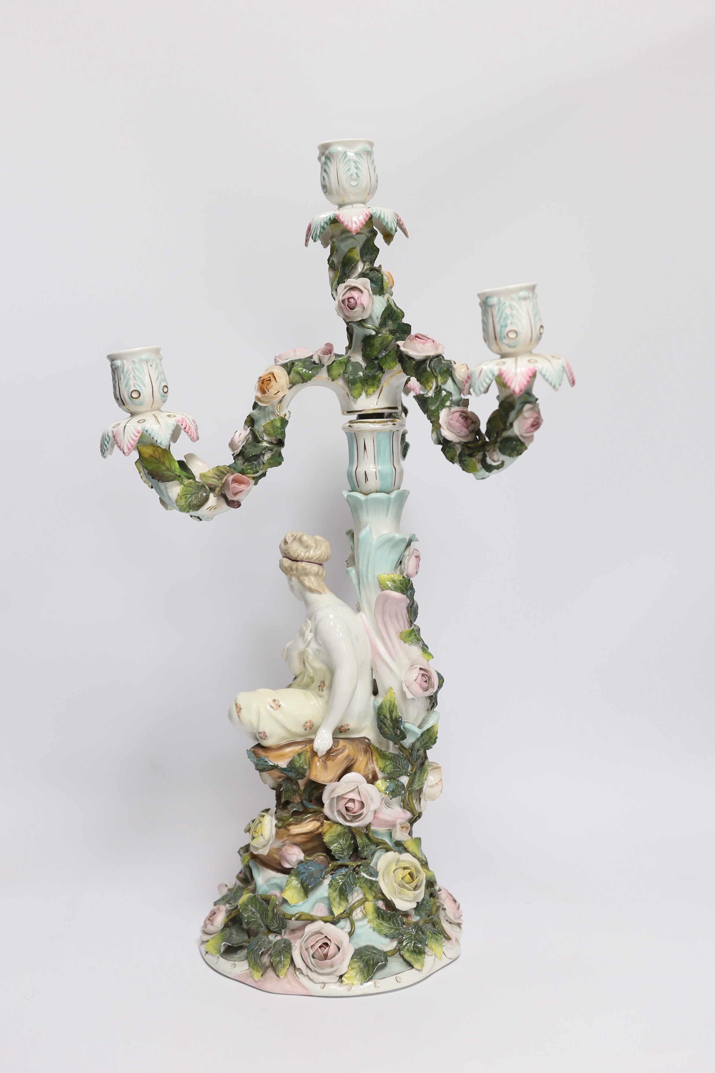 A 19th century Sitzendorf floral encrusted four light figural candelabra, 50cm